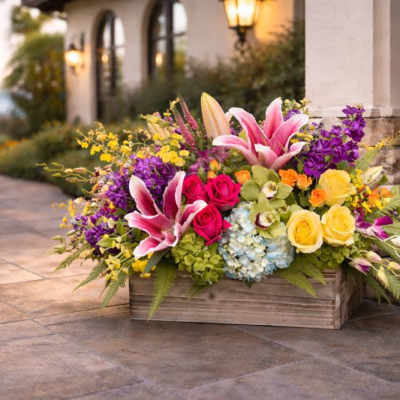 Colorful flower arrangement in a wooden planter box