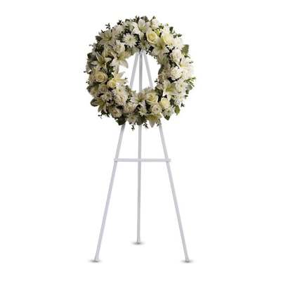 White floral wreath on a standing easel