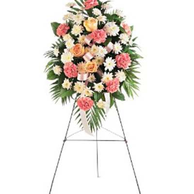 Standing floral spray with pink and white flowers on an easel