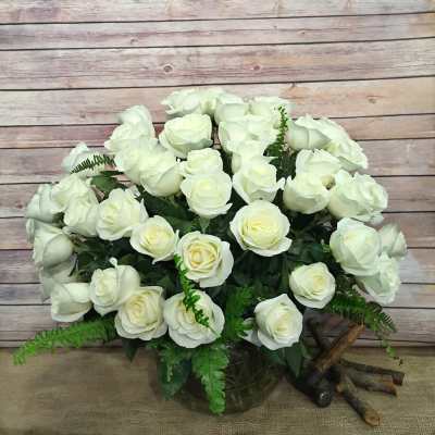 Bouquet of white roses in a glass vase