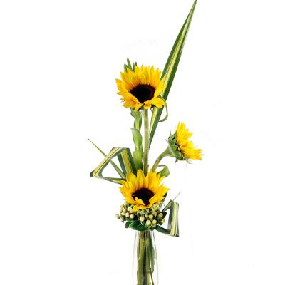 Tall sunflower arrangement in a clear glass vase
