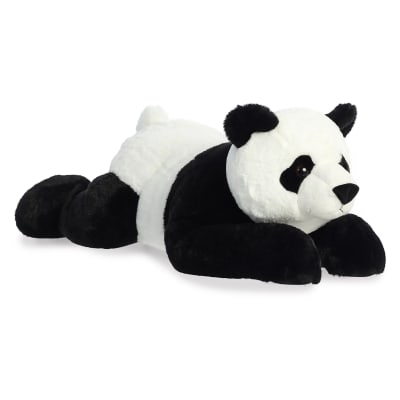 Plush panda bear lying down on a white background