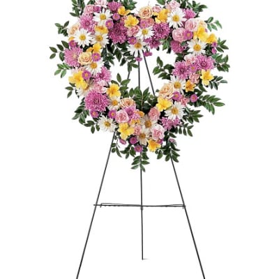 Heart-shaped floral wreath on a standing easel