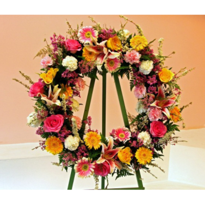 Colorful floral wreath on a green easel