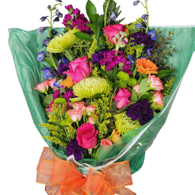 Colorful mixed bouquet wrapped in green paper with an orange bow