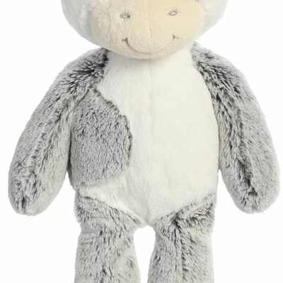 Gray and white plush cow stuffed animal with a smiling face