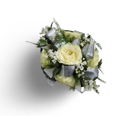 Bouquet of pale yellow roses with white filler flowers and silver ribbon