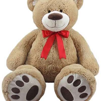 Plush teddy bear with a red ribbon bow