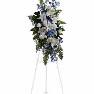 Tall white and blue floral spray on a standing easel