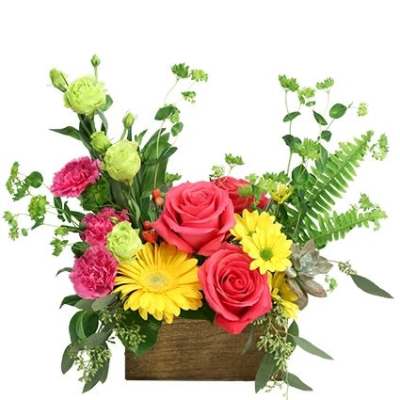 Mixed bouquet of pink roses, yellow daisies, and green blooms in a wooden box