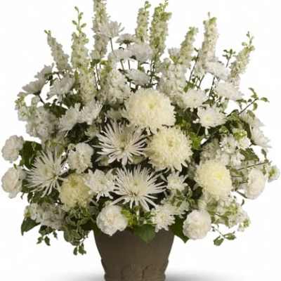 White floral arrangement in a brown vase