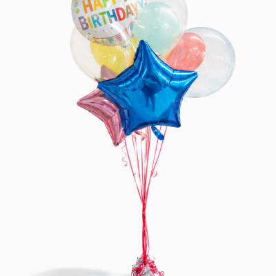 Birthday balloon bouquet with a blue star balloon and a printed Happy Birthday balloon