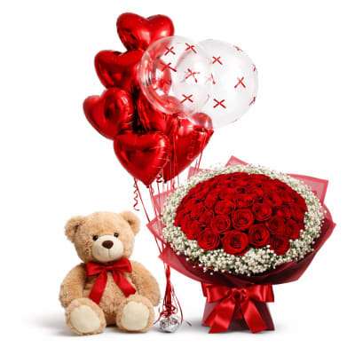 Red rose bouquet with heart balloons and a teddy bear