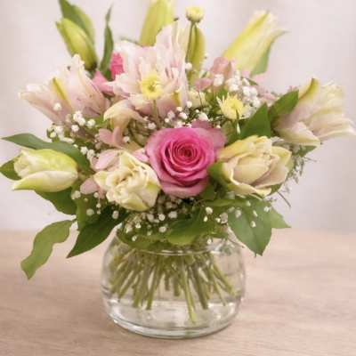 Pink and white bouquet in a clear glass vase with a "You're Special!" card