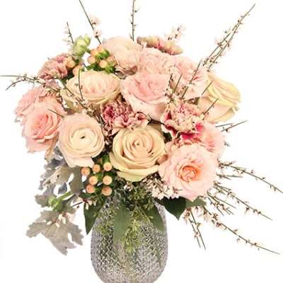 Blush roses and carnations in a textured silver vase