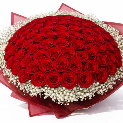 Large bouquet of red roses with white baby's breath wrapping