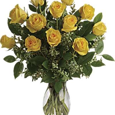 Yellow roses arranged in a clear glass vase
