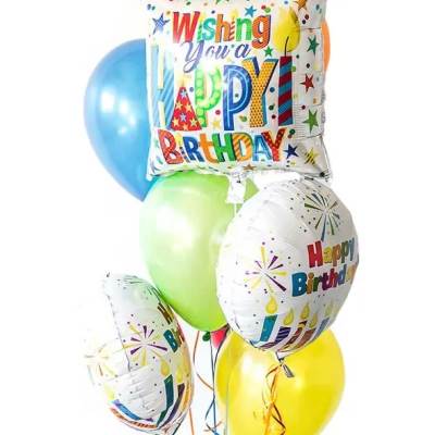 Bundle of colorful latex and foil Happy Birthday balloons with curling ribbons.