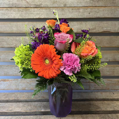 Sofia vase purple and orange flowers ( designer's choice of flowers)