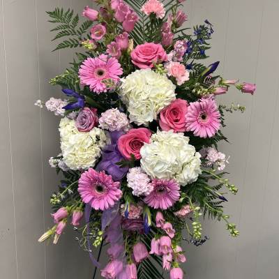 Pink and white floral standing spray with roses and gerbera daisies