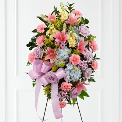 Standing floral spray with pink lilies, roses, carnations, and hydrangeas