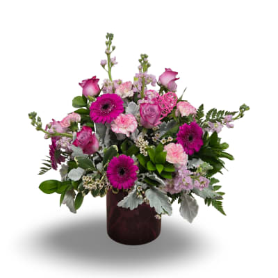 Pink and magenta mixed bouquet in a dark vase
