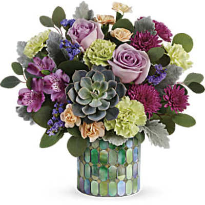 Mixed bouquet with lavender roses and a succulent in a mosaic vase