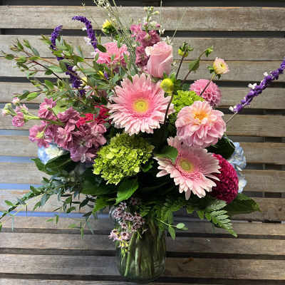 Pink and purple mixed bouquet in a glass vase