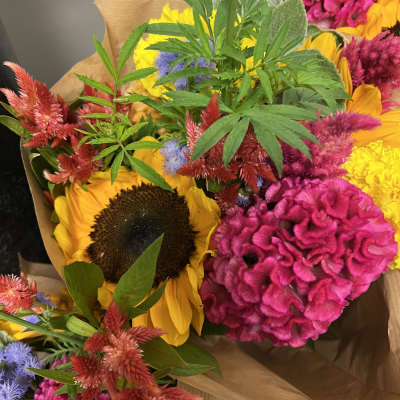 Bright mixed bouquet with sunflowers and pink cockscomb flowers