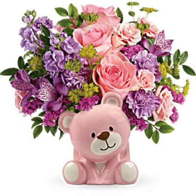 Pink teddy bear planter with pink and purple flowers