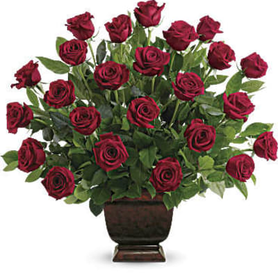 Red roses arranged in a dark urn vase