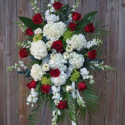 Standing floral spray with red roses and white hydrangeas