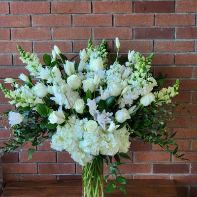 White floral arrangement in a clear glass vase