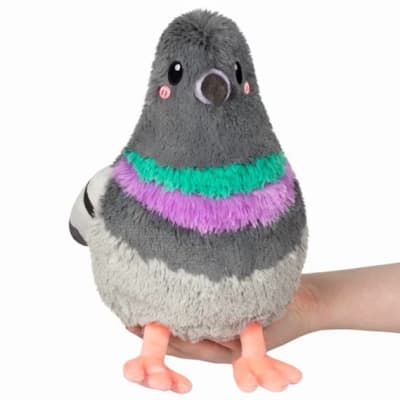 Plush pigeon toy with gray, white, and purple accents held in a hand