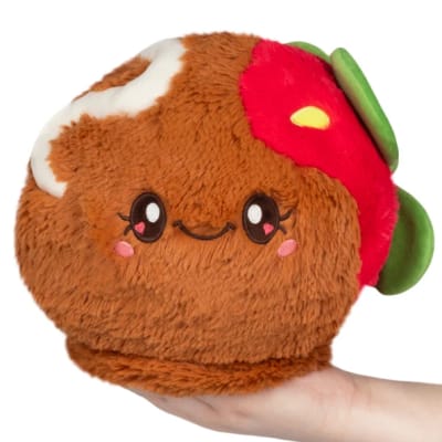 Plush taco-shaped stuffed toy with a smiling face