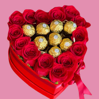 Heart-shaped box of red roses with gold-wrapped chocolates