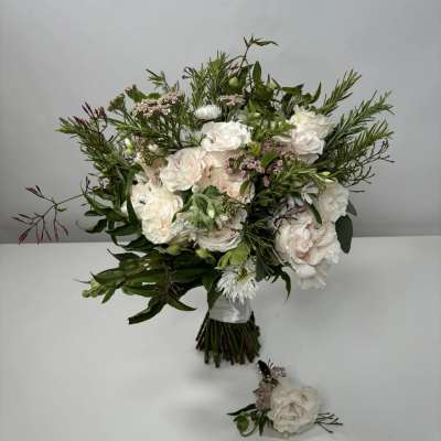 White and blush bouquet with greenery and a matching boutonniere