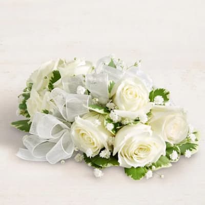 White rose bouquet with baby's breath and a sheer ribbon