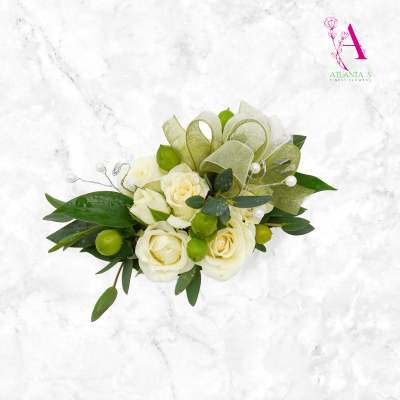 White rose bouquet with green ribbon loops and pearl accents