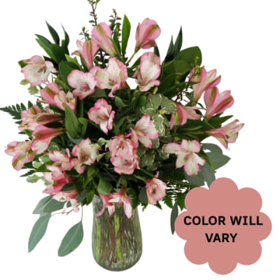 Pink alstroemeria bouquet in a glass vase with a color-will-vary note