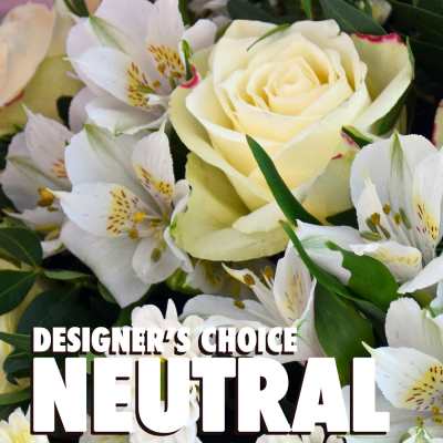 Neutral-toned arrangement with cream roses and white alstroemeria in a close-up view
