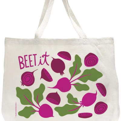 White canvas tote bag with pink beet illustrations, green leaves, and the phrase “BEET it” in pink lettering