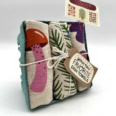 Set of three printed dish towels in a teal tray with mushroom and foliage designs