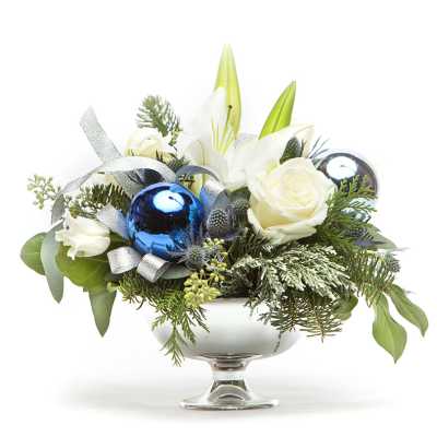 White roses and lilies in a silver compote with blue ornaments