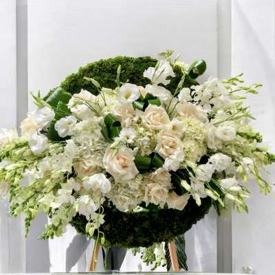 White and blush floral standing spray with green accents