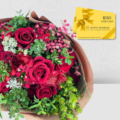 Bouquet of red roses with pink berries and a gift card