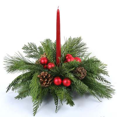 Red candle in a pine and pinecone holiday centerpiece