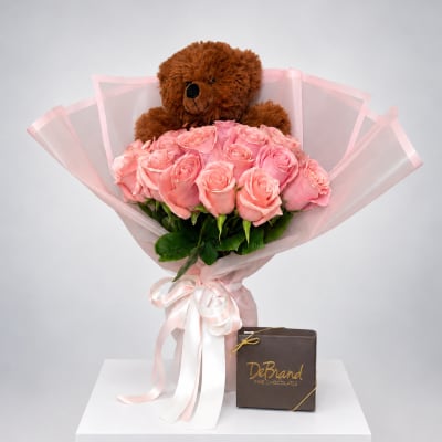 Pink rose bouquet with a teddy bear and chocolate box