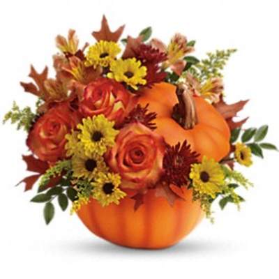 Pumpkin-shaped floral arrangement with orange roses and yellow daisies