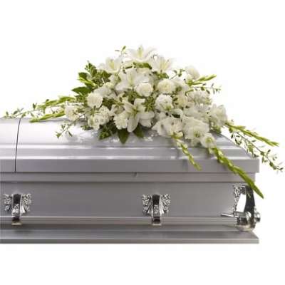 White floral spray on a silver casket
